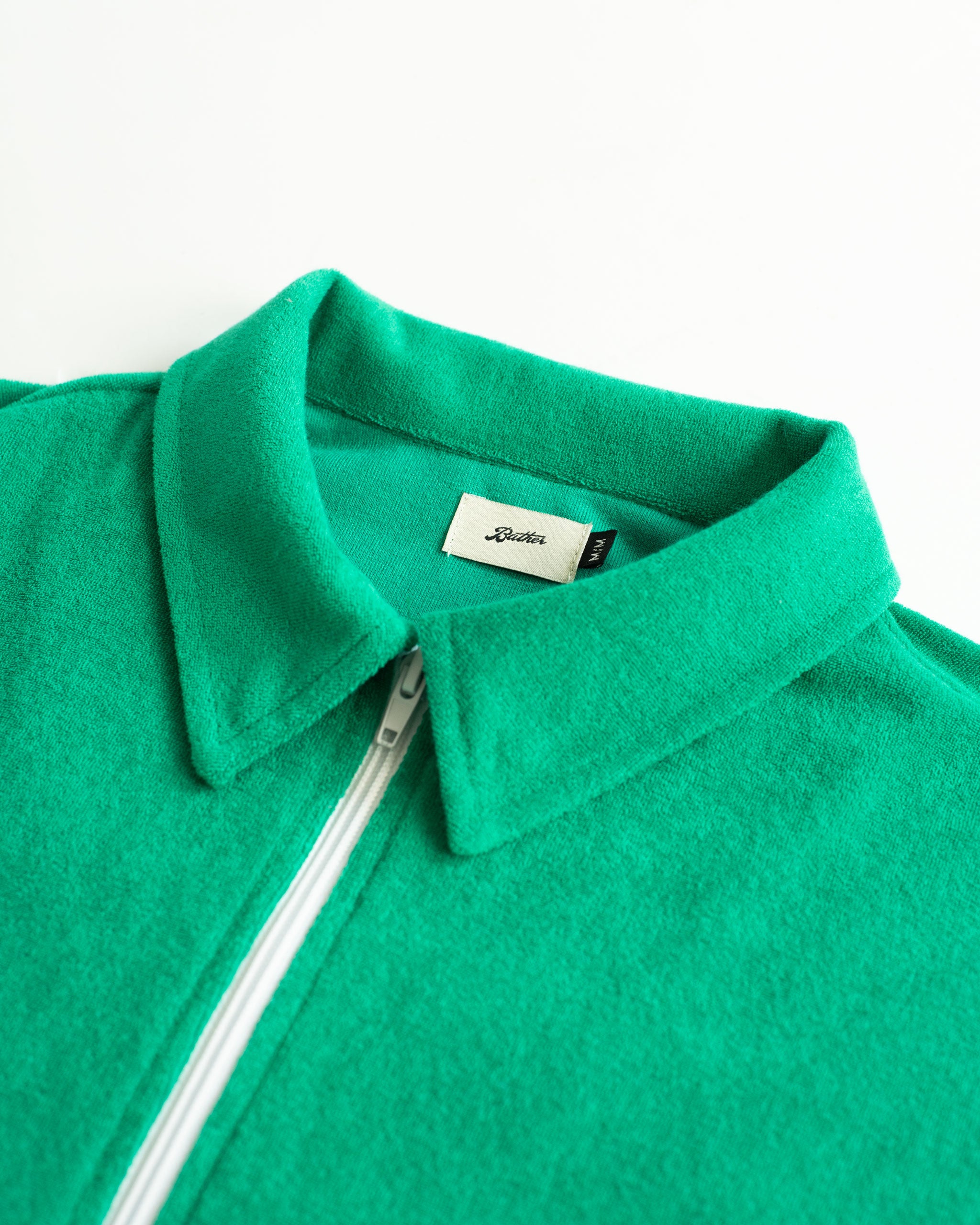 Collar Close Up of Solid Green Towel Terry Cotton Full Zip Polo Shirt