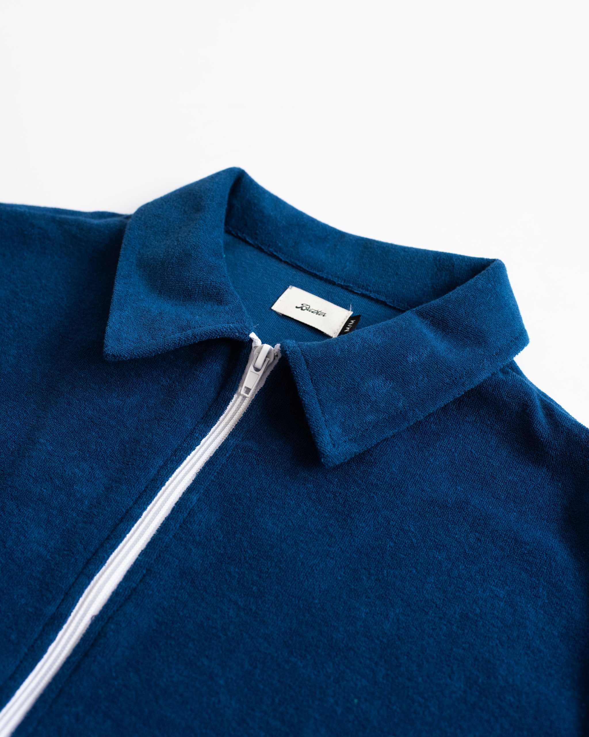 Collar Close Up of Solid Navy Towel Terry Cotton Full Zip Polo Shirt