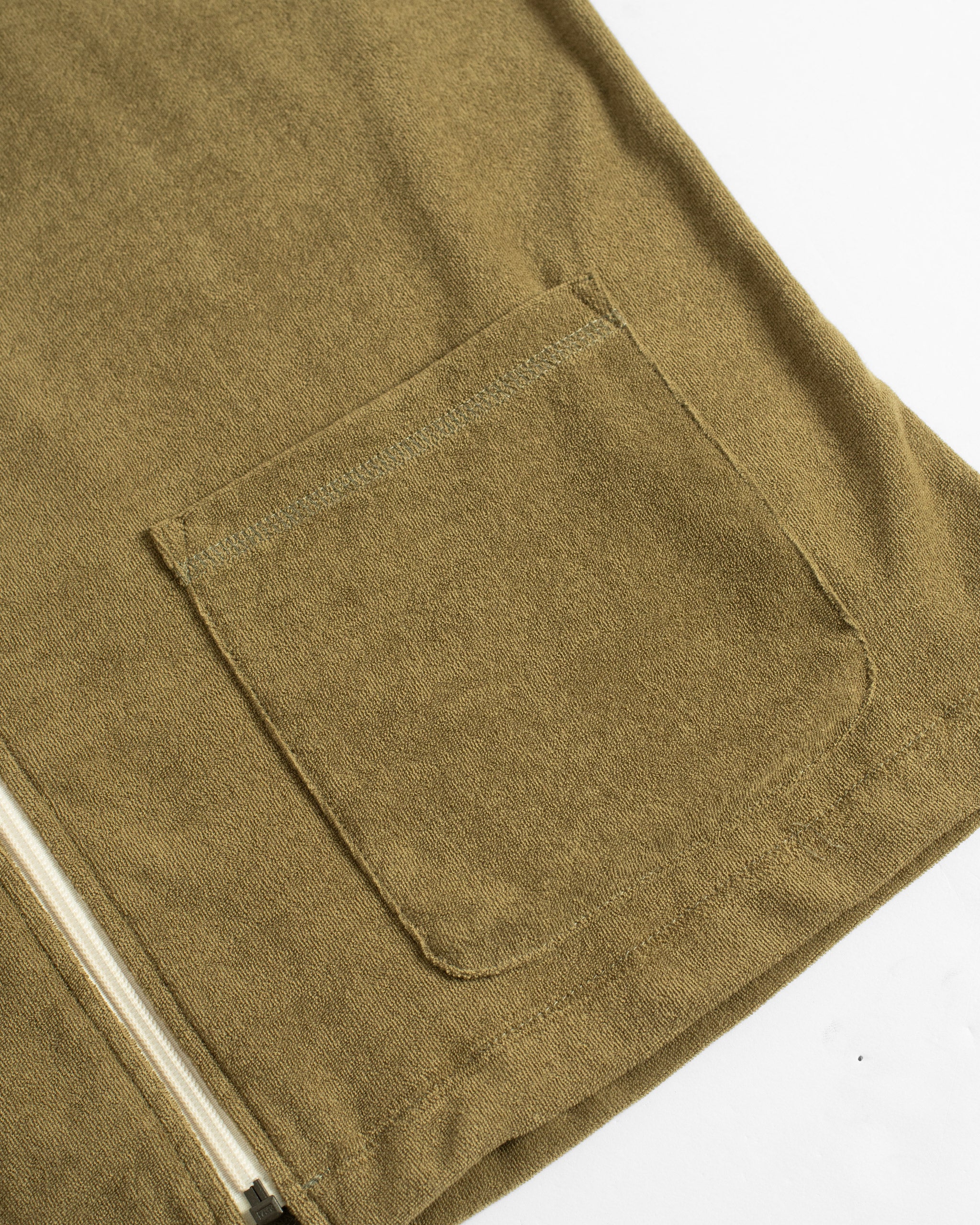 BATHER GREEN zip polo on white background