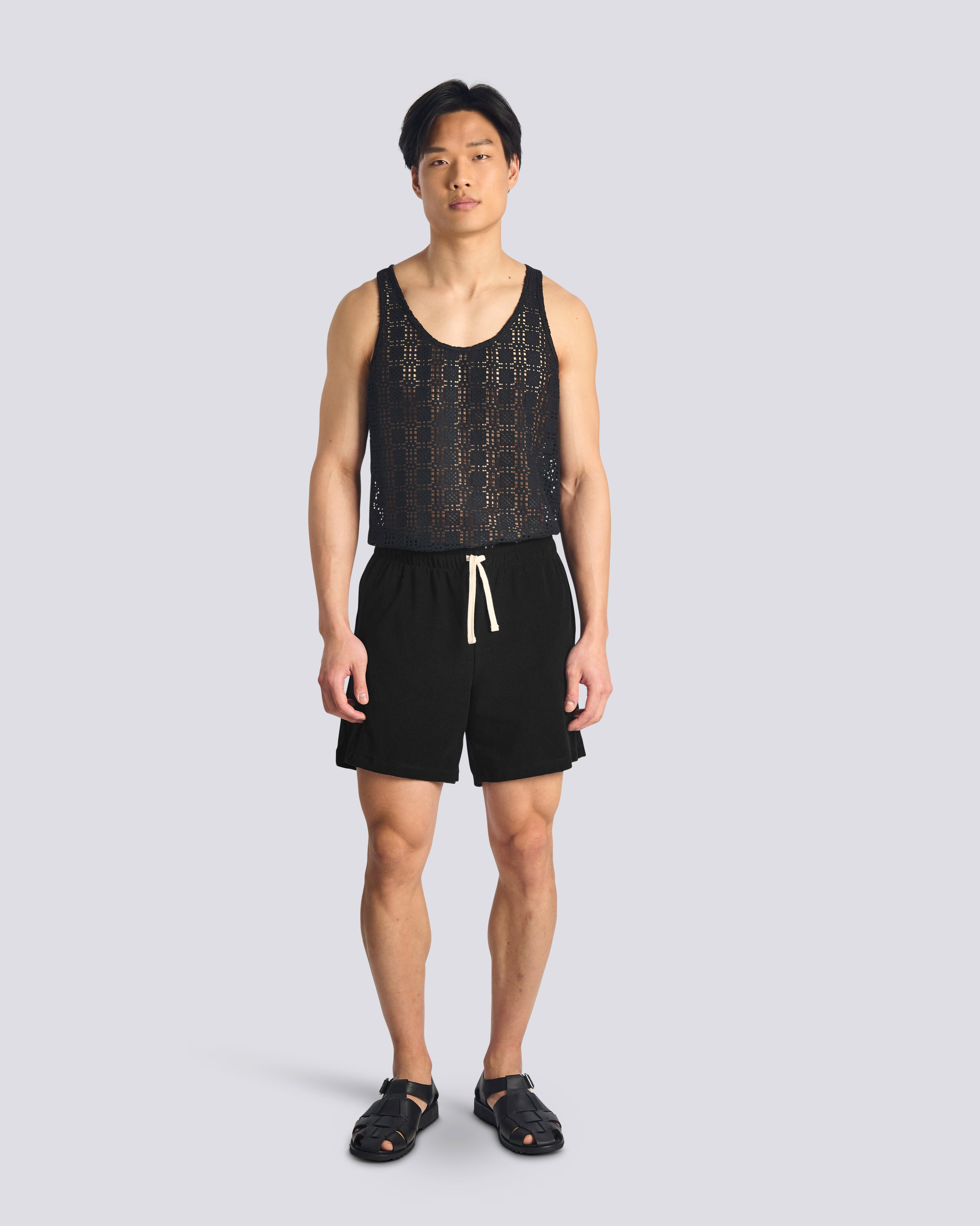 Model wearing Bather men's black towel terry drawstring shorts