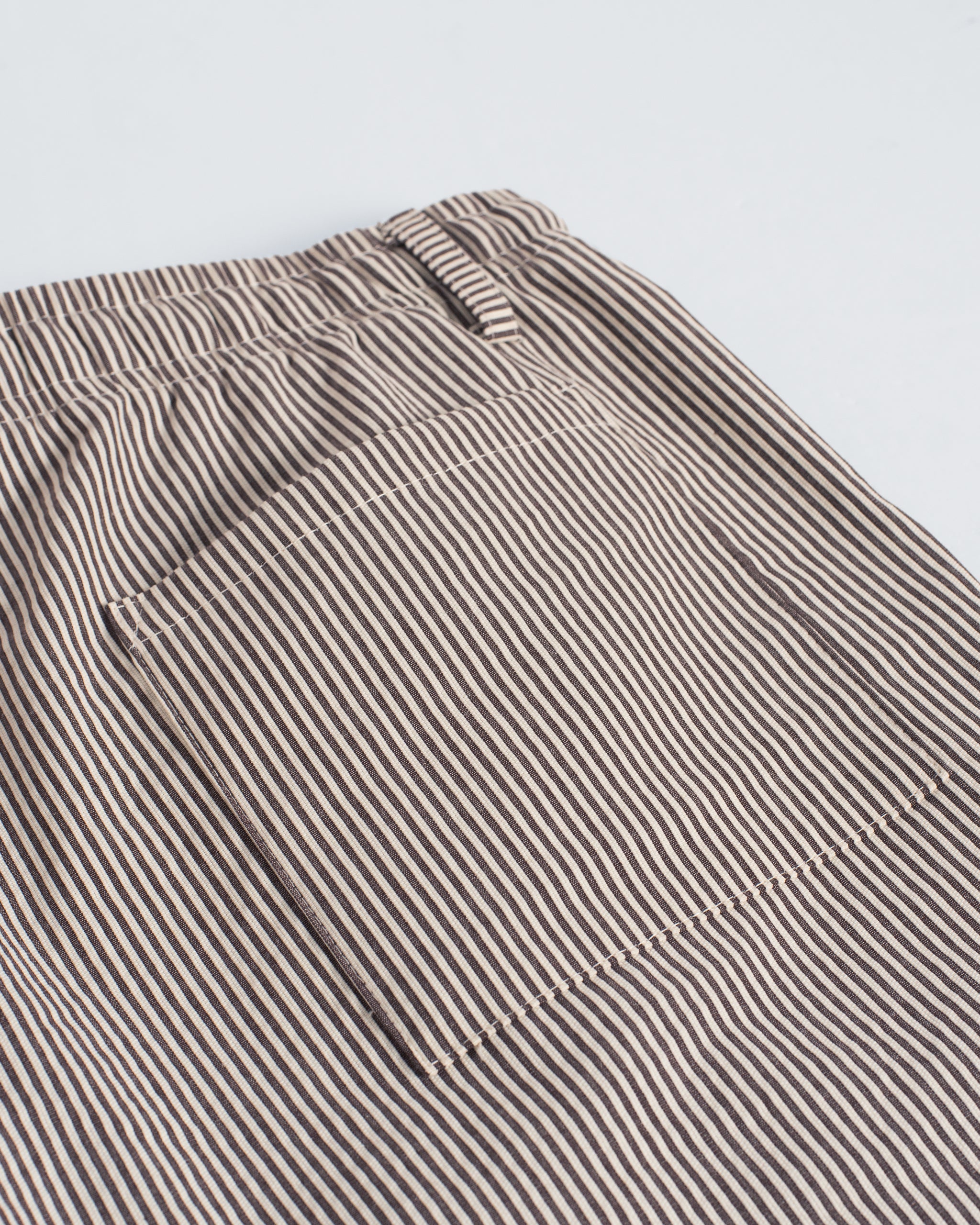 Back pocket detail of Bather men's brown pinstripe shorts