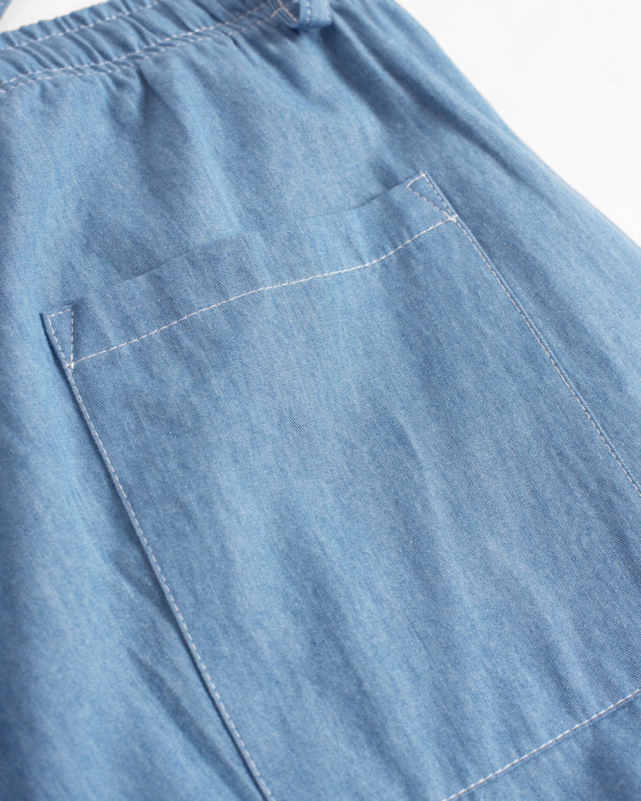 Bather mens light blue denim leisure pant detail shot on white background