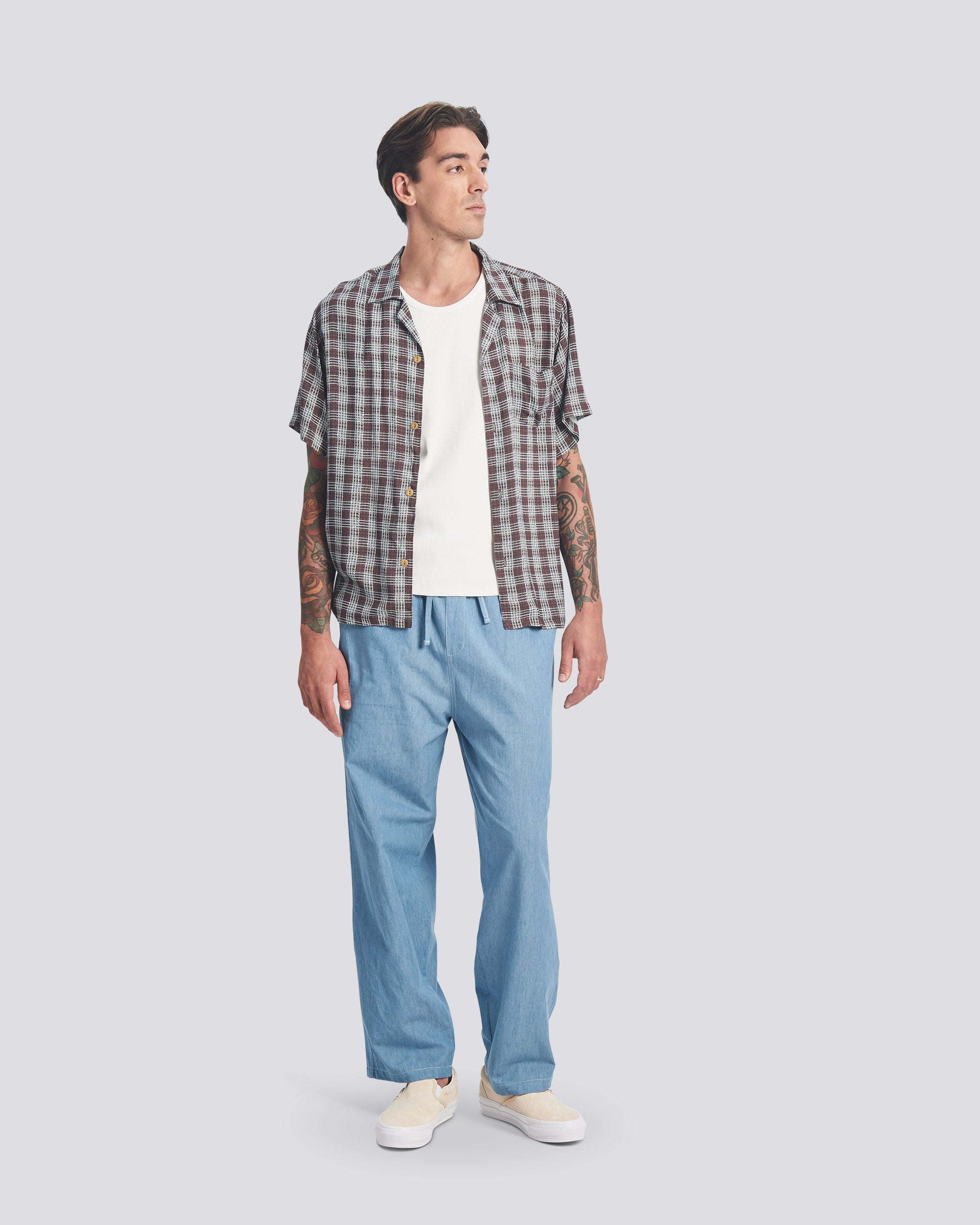 Bather mens light blue denim leisure pant worn by model on white background
