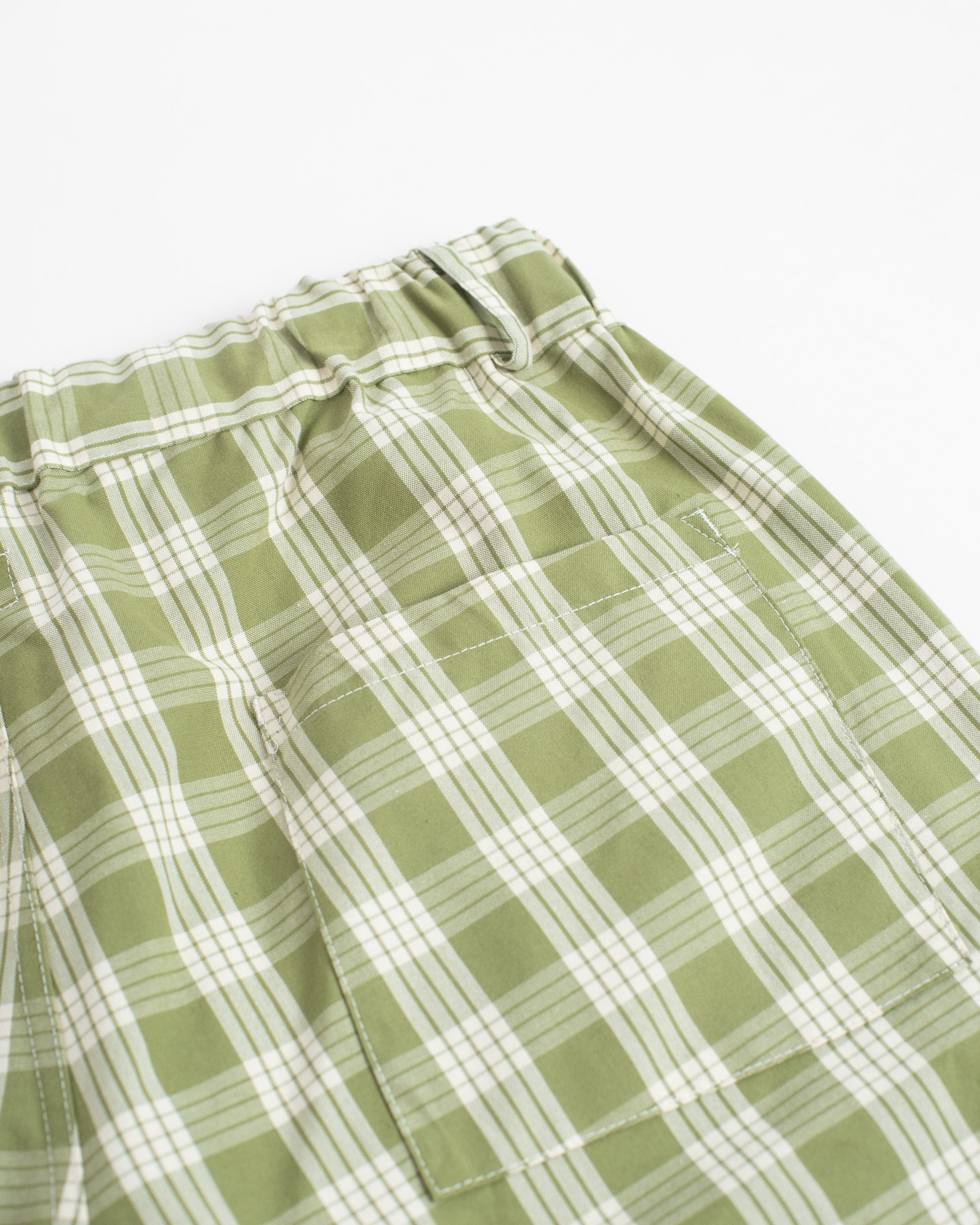 Back pocket detail of Bather men's green check short