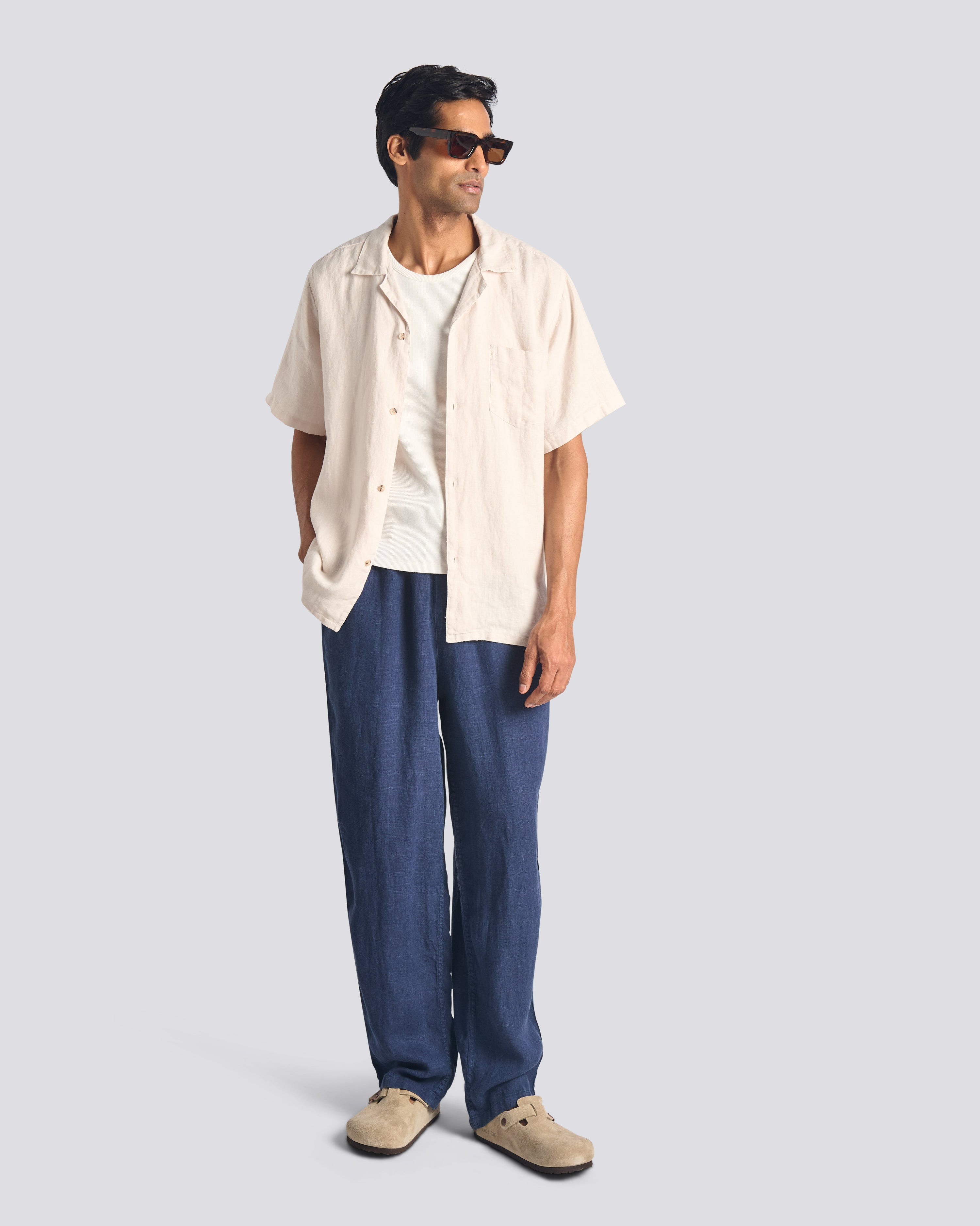 Bather men's navy linen drawstring pant worn by model on white background