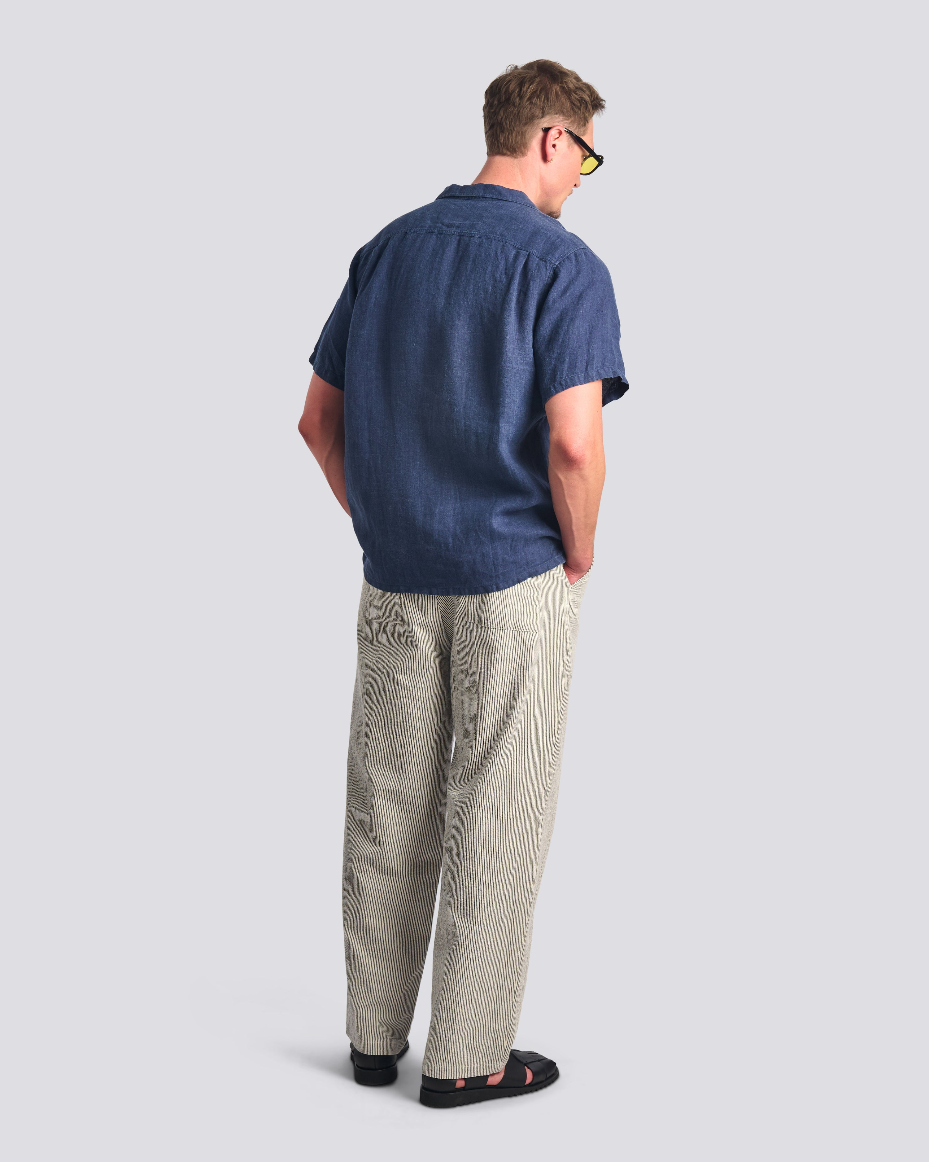 Bather men's navy pinstripe drawstring pant worn by model on a white background