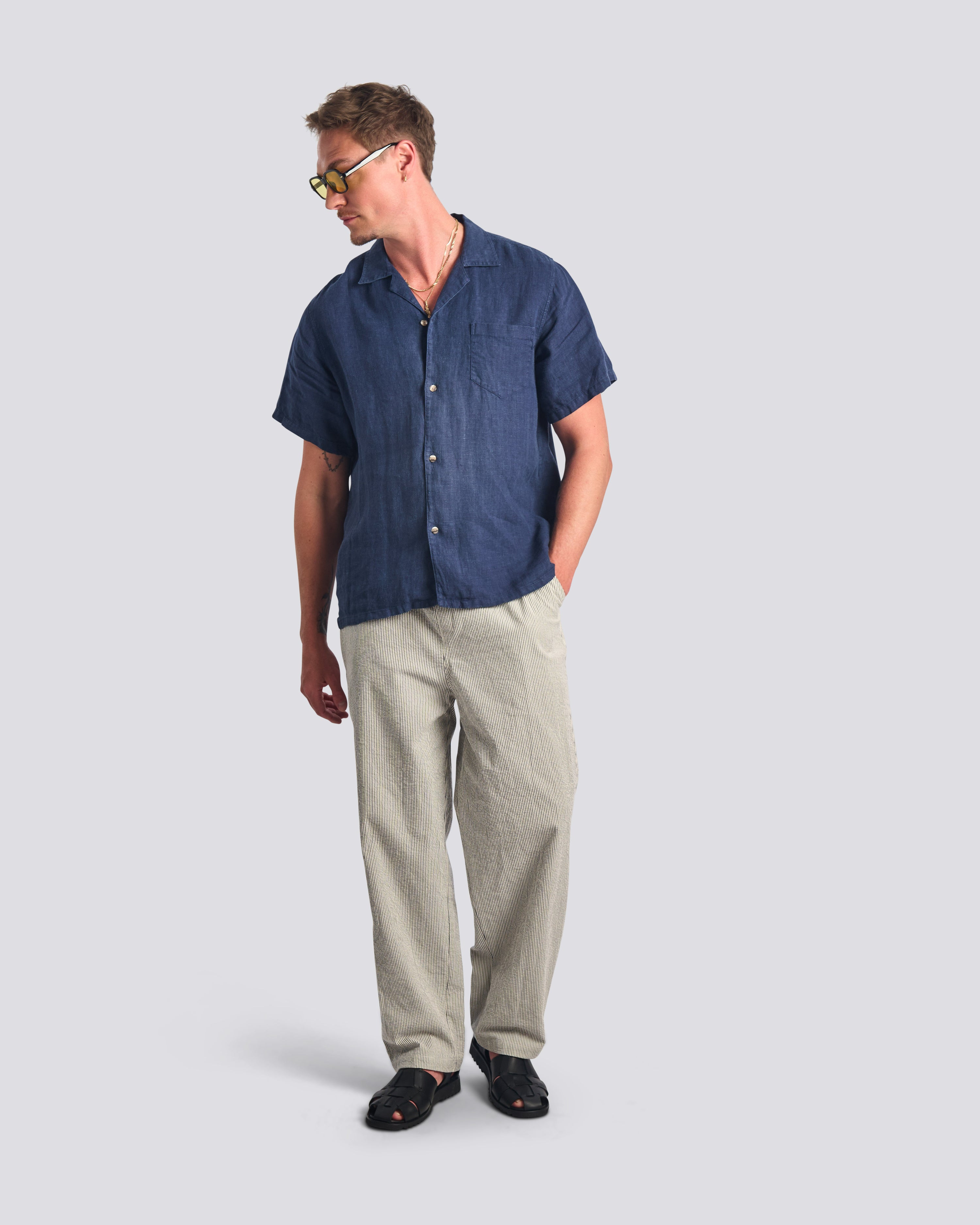 Bather men's navy pinstripe drawstring pant worn by model on a white background