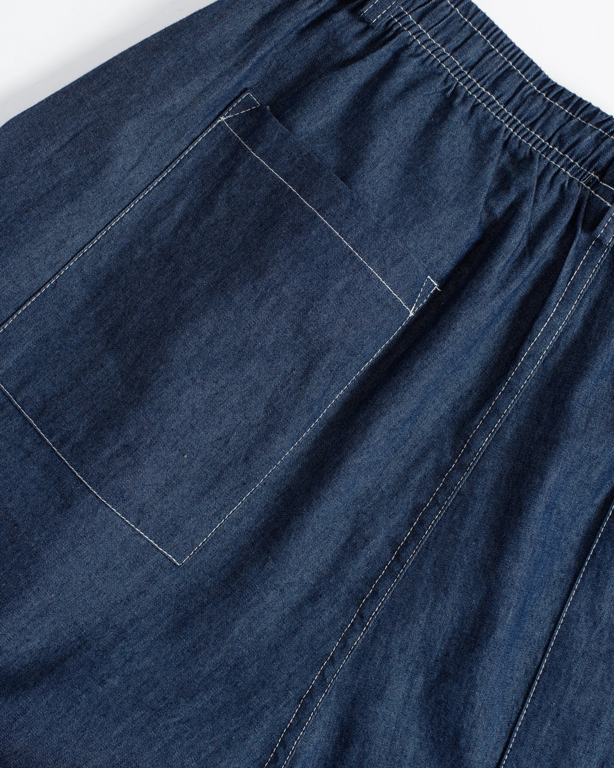 Bather men's dark wash denim leisure pant pocket detail on white background