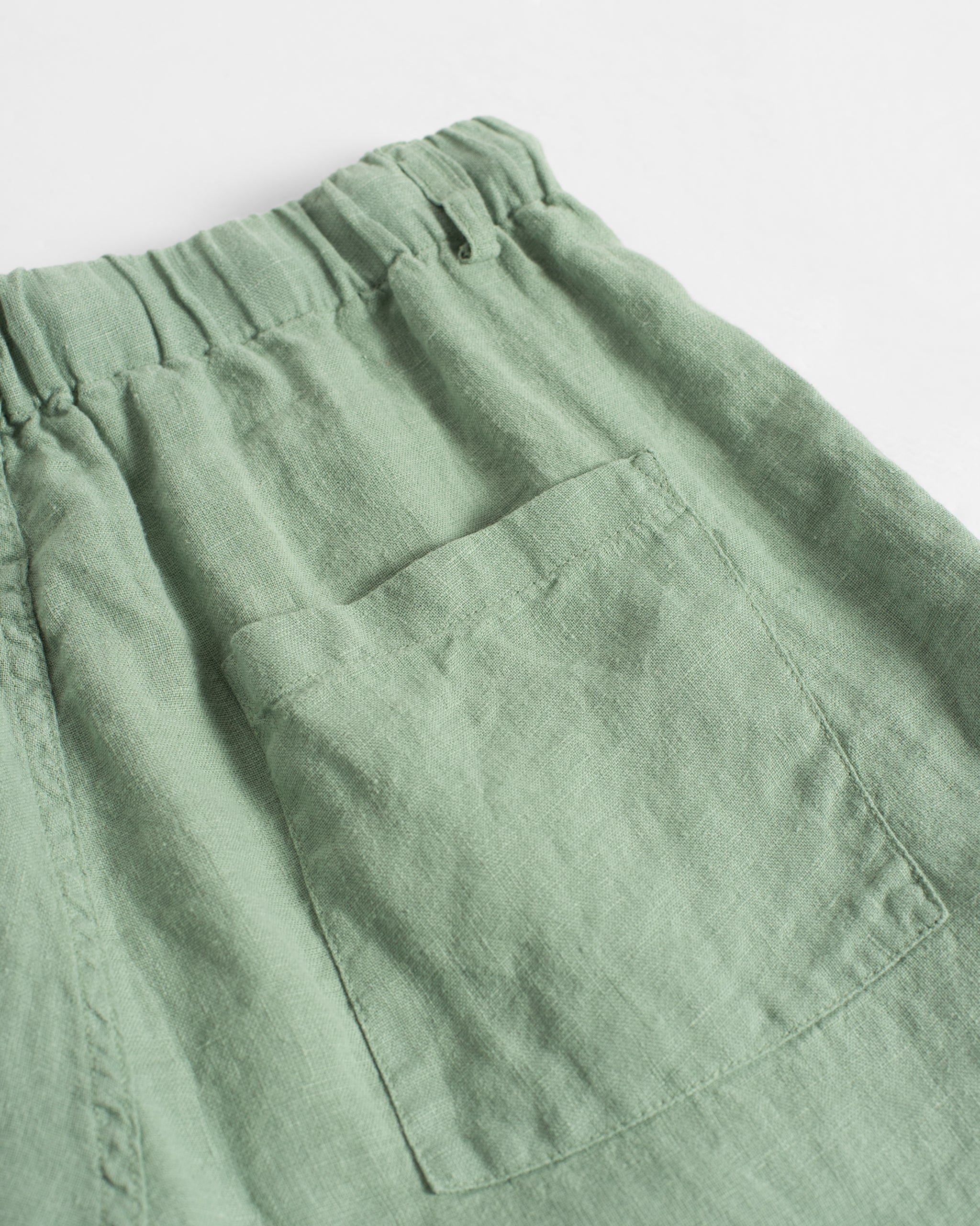 Back pocket detail of Bather men's light green linen drawstring pant