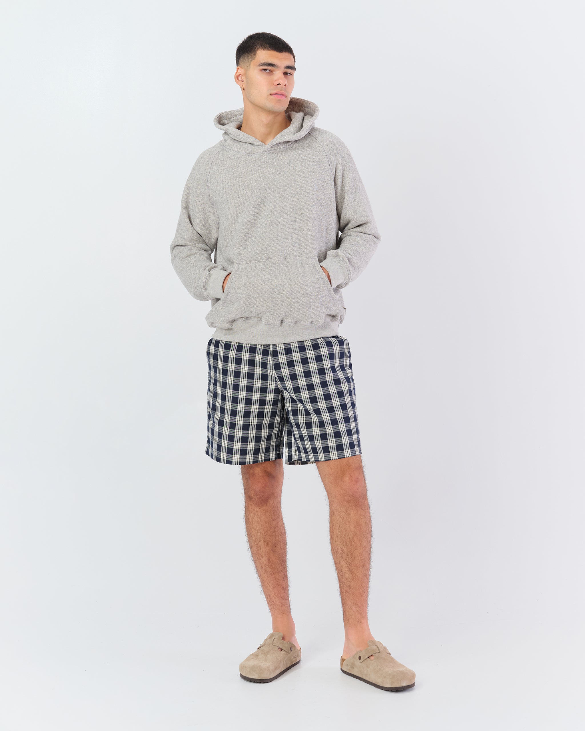 Male model wearing Bather men's black check short