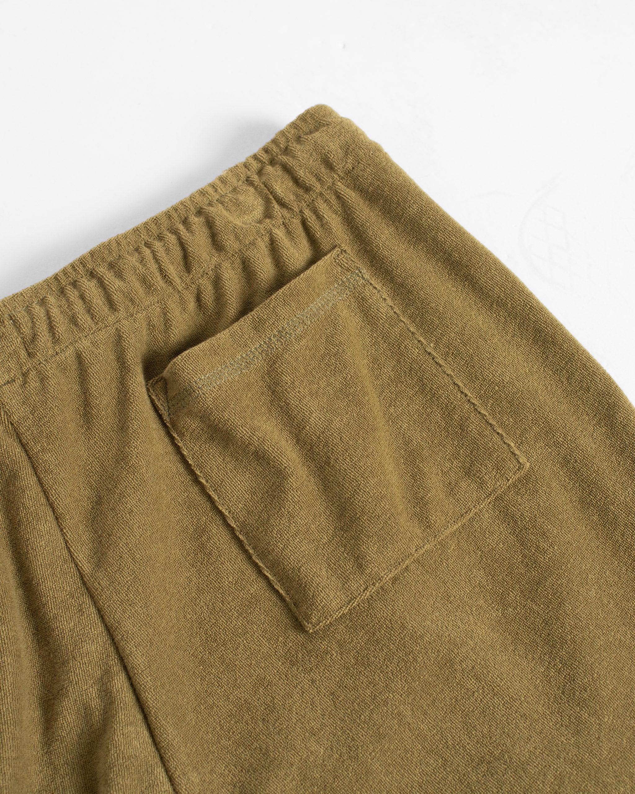 Back pocket closeup of Bather men's army green towel terry shorts
