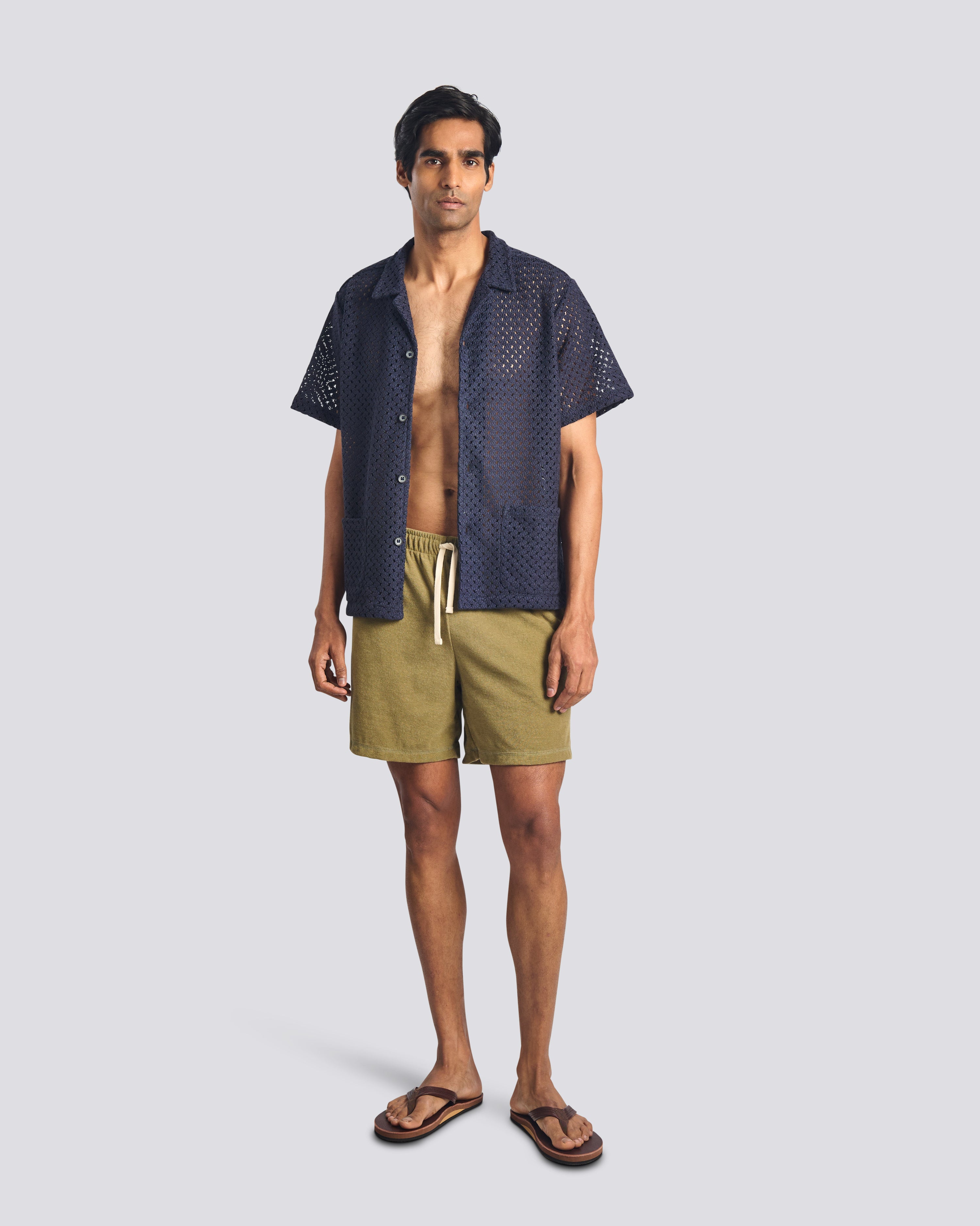 Model wearing Bather men's army green towel terry drawstring short