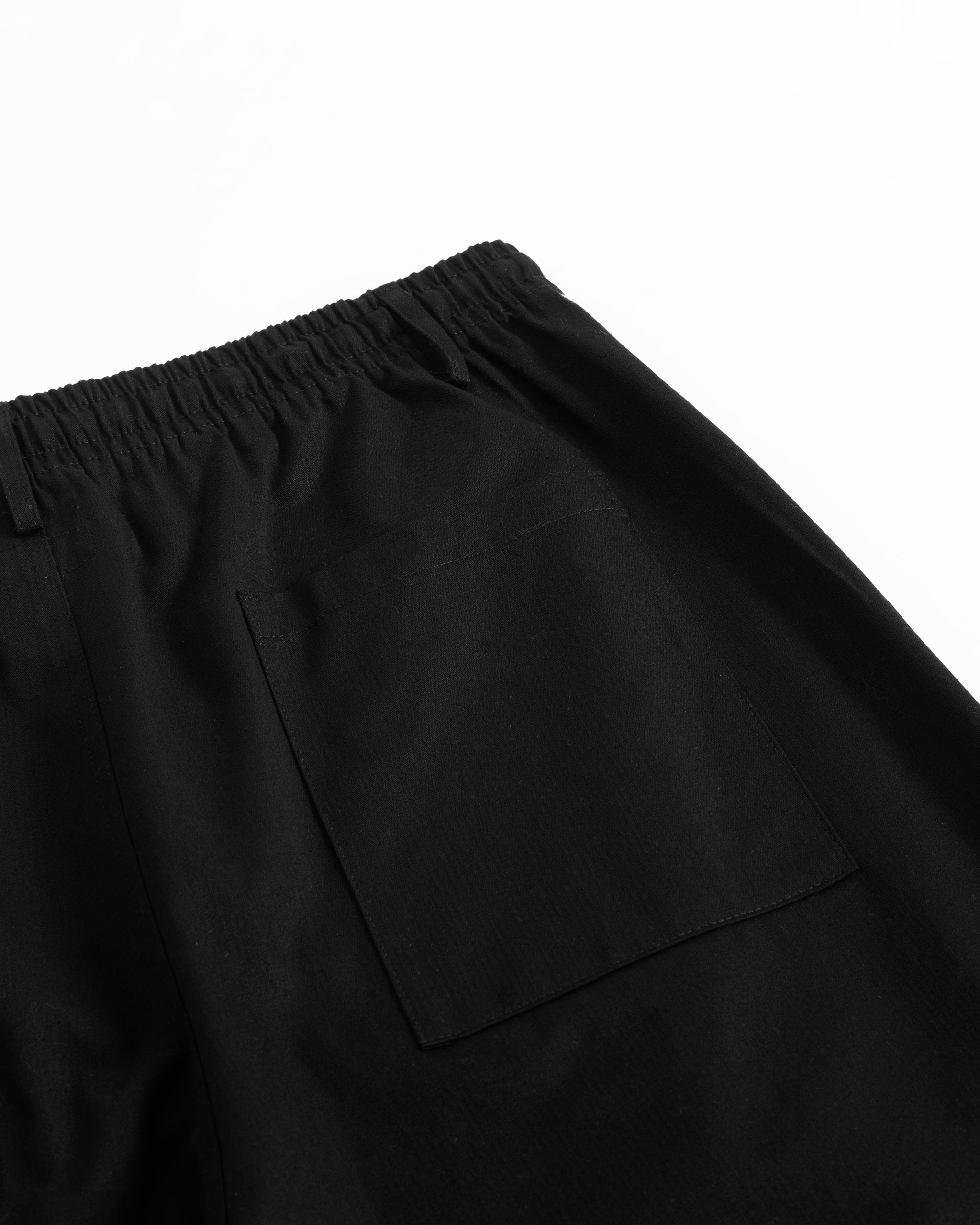 Back pocket detail of Bather men's black herringbone leisure shorts