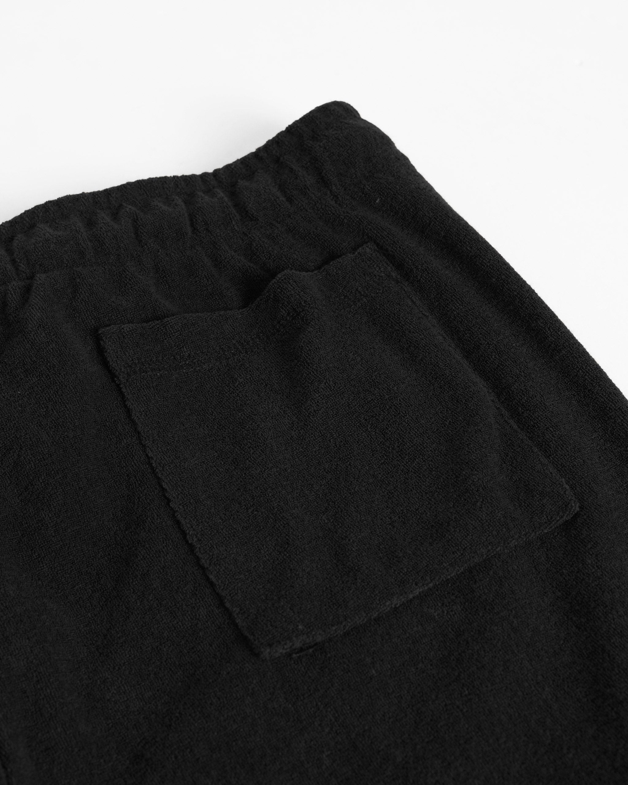 Back pocket closeup of Bather men's black towel terry drawstring shorts