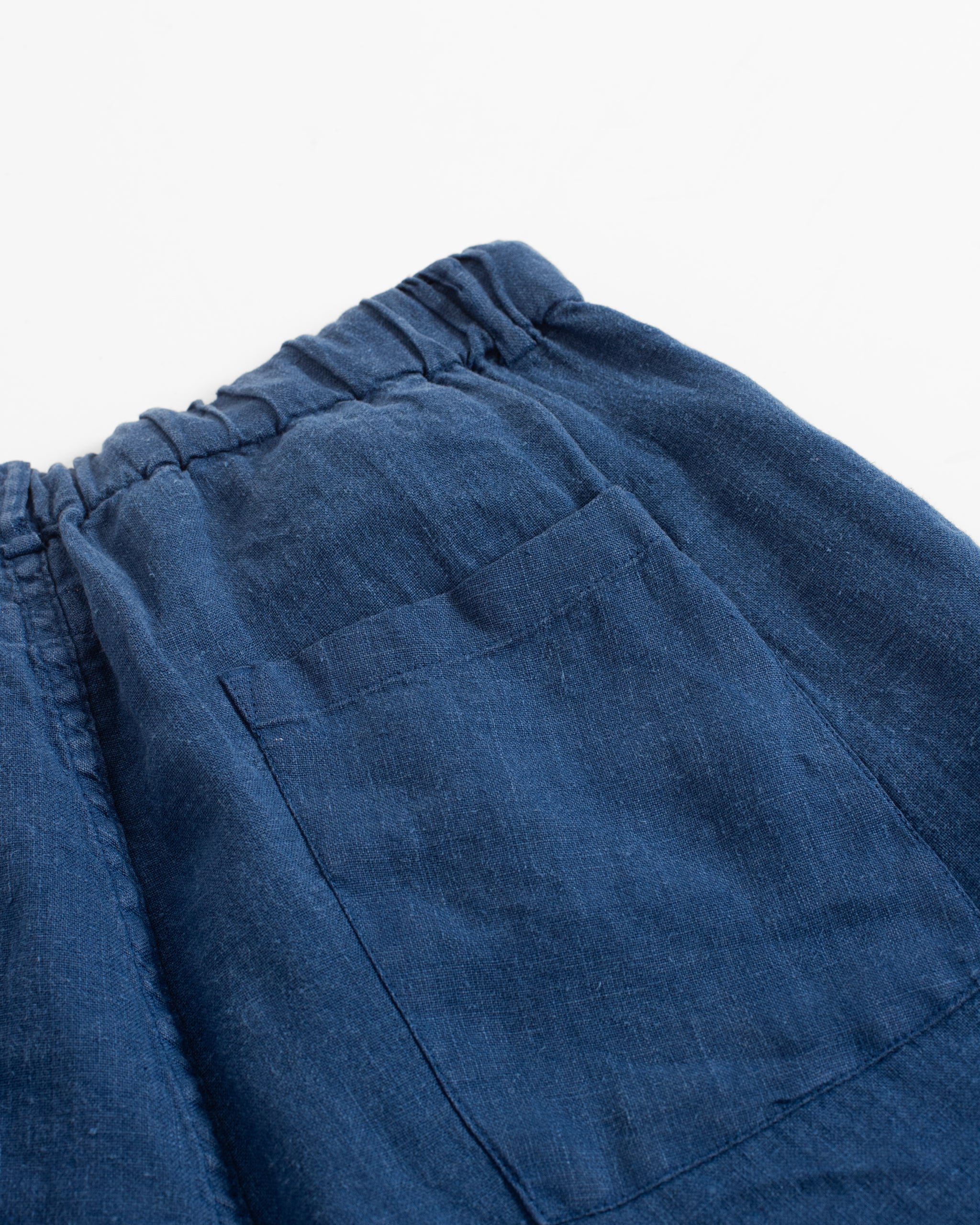 Back pocket detail of Bather men's blue linen drawstring short
