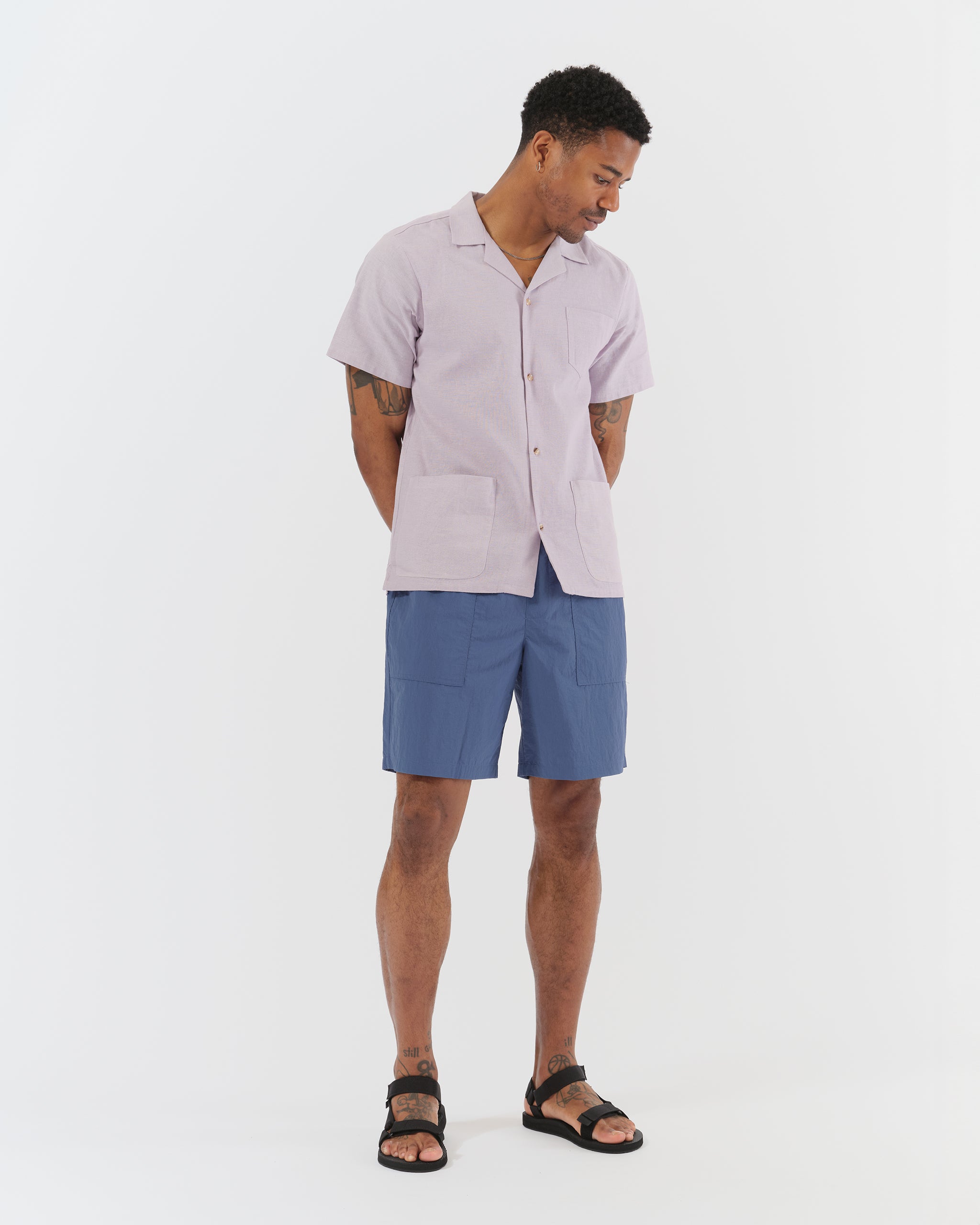 Model wearing Bather men's solid blue utility short