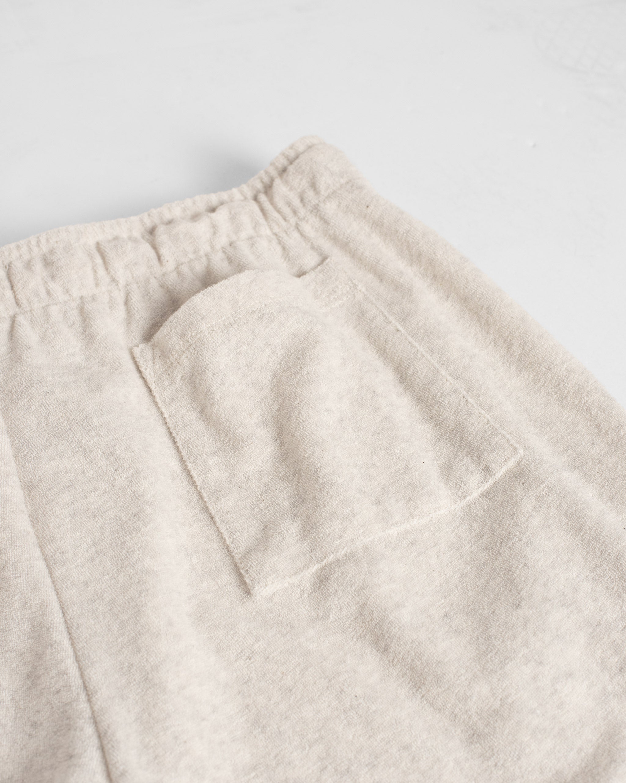 Back pocket detail of Bather men's cream towel terry drawstring shorts