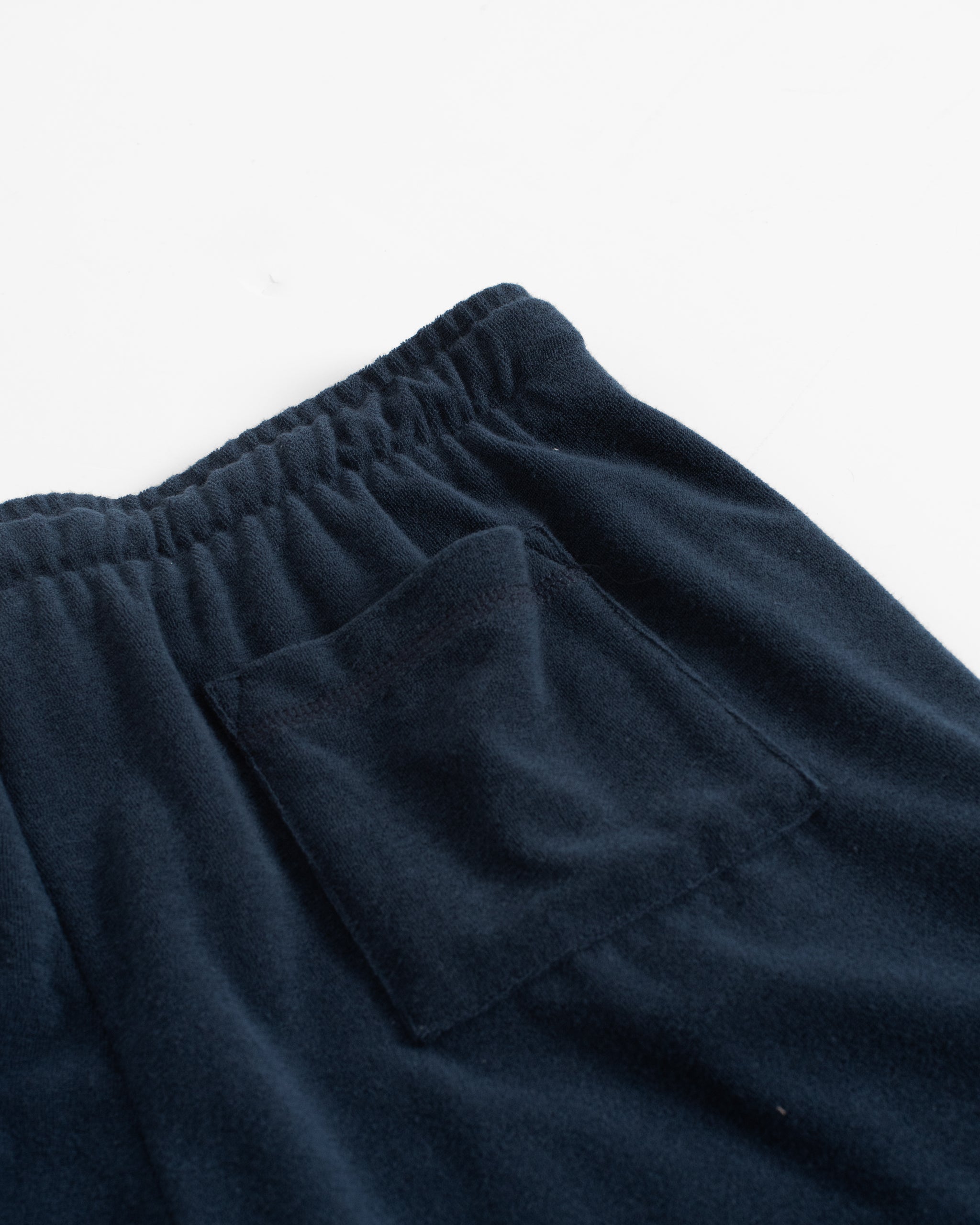 Back pocket detail of Bather men's dark blue towel terry drawstring short