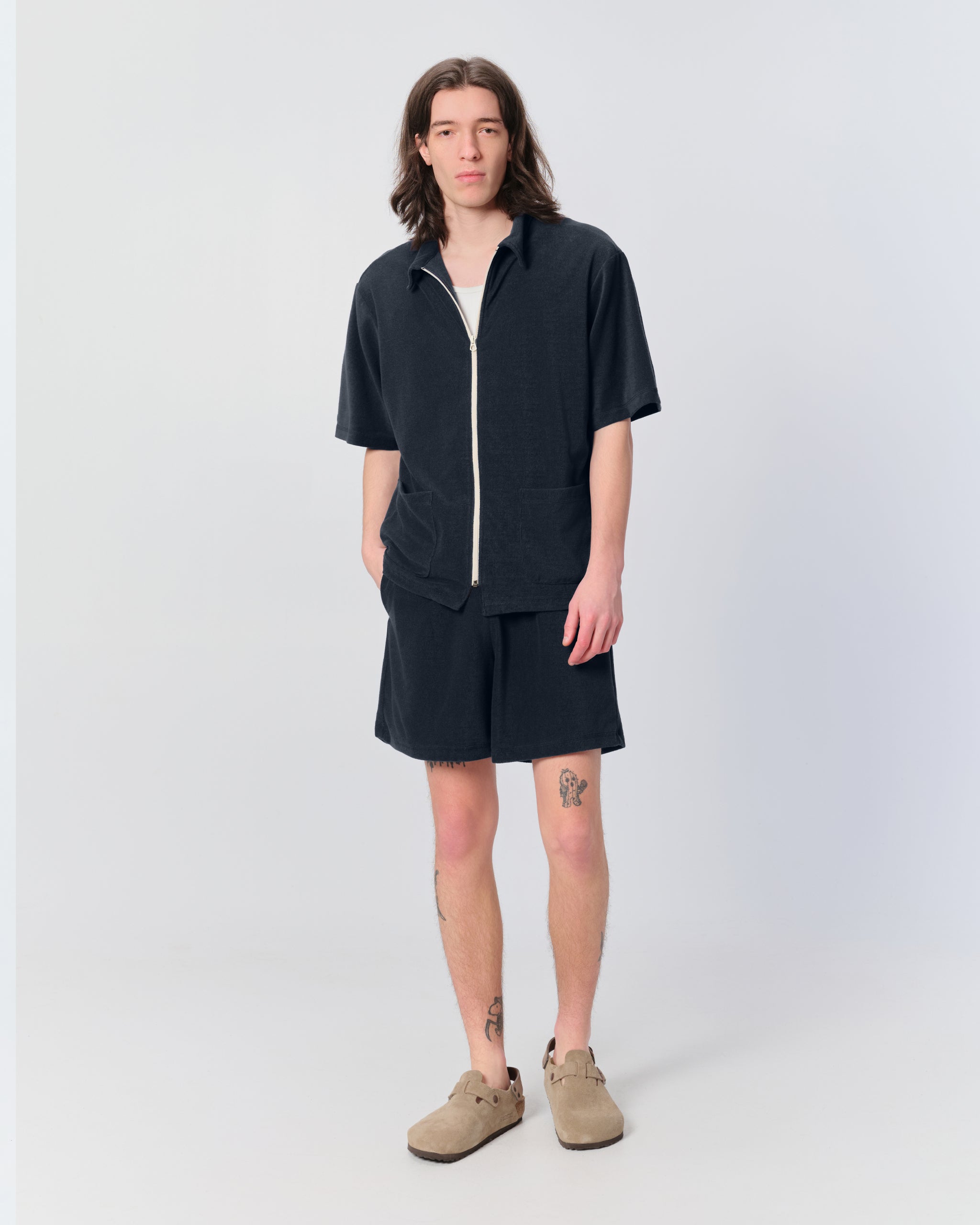 Model wearing Bather men's dark blue towel terry drawstring short