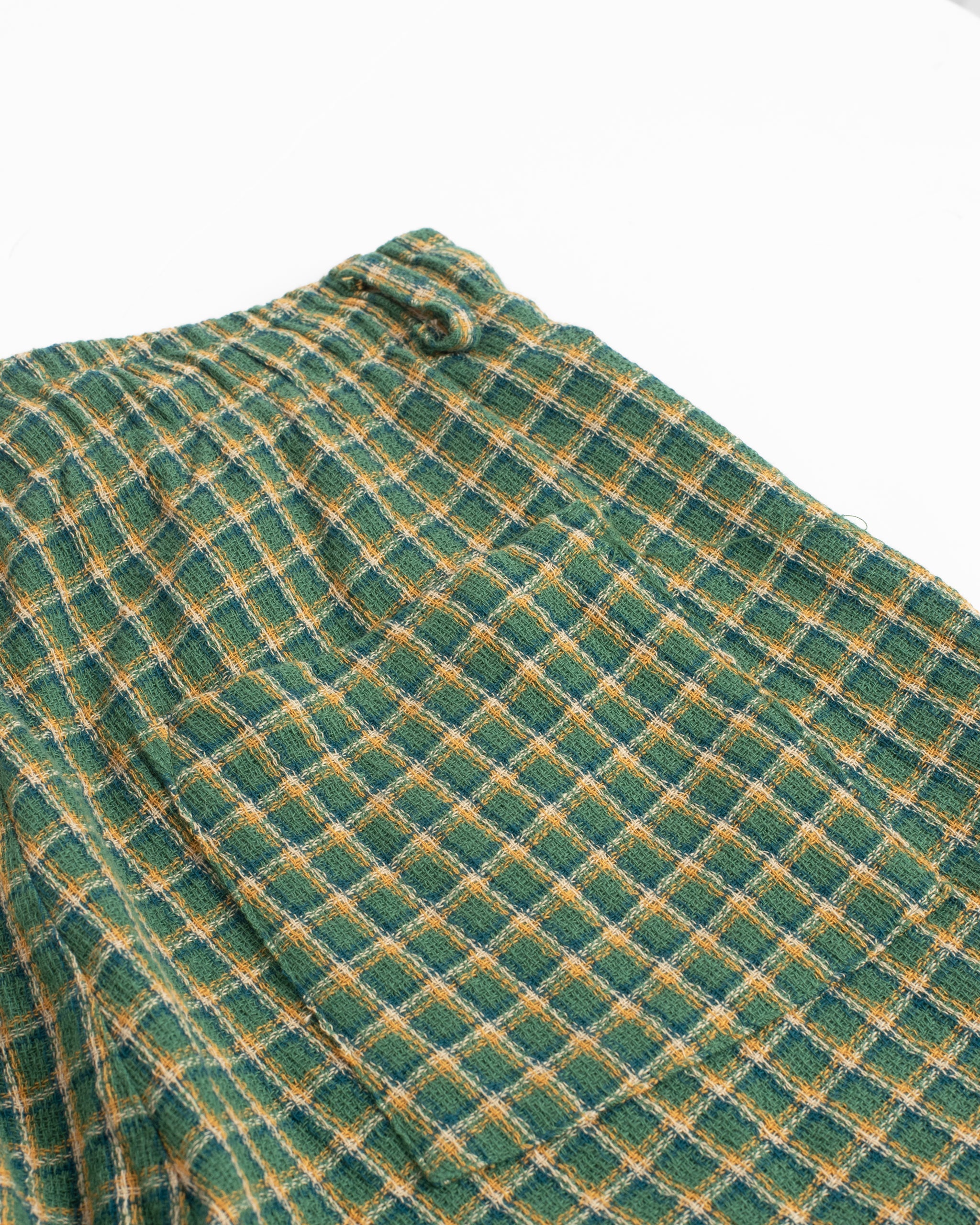 Back pocket detail of Bather men's green and yellow check drawstring shorts