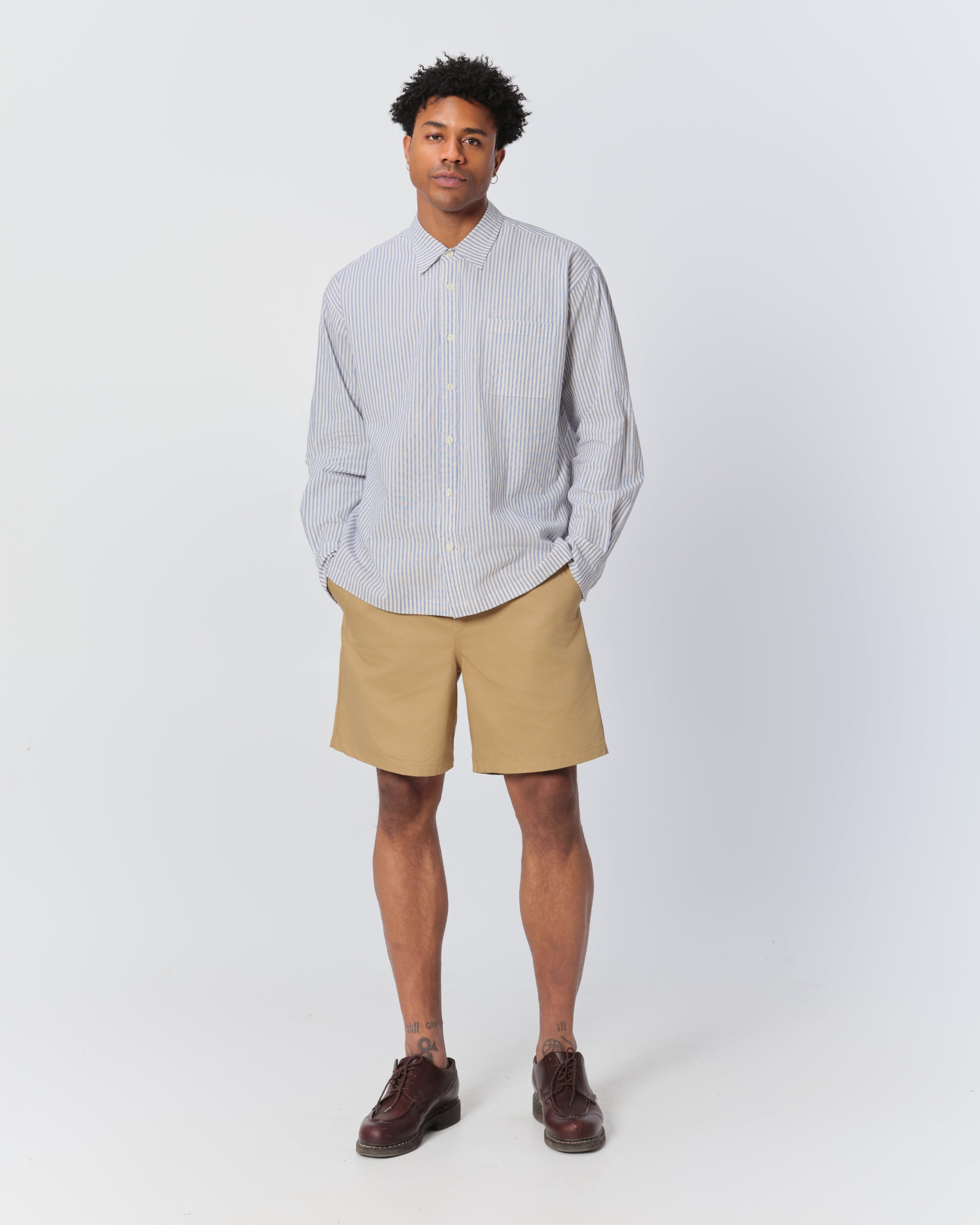 Model wearing Bather men's khaki drawstring shorts