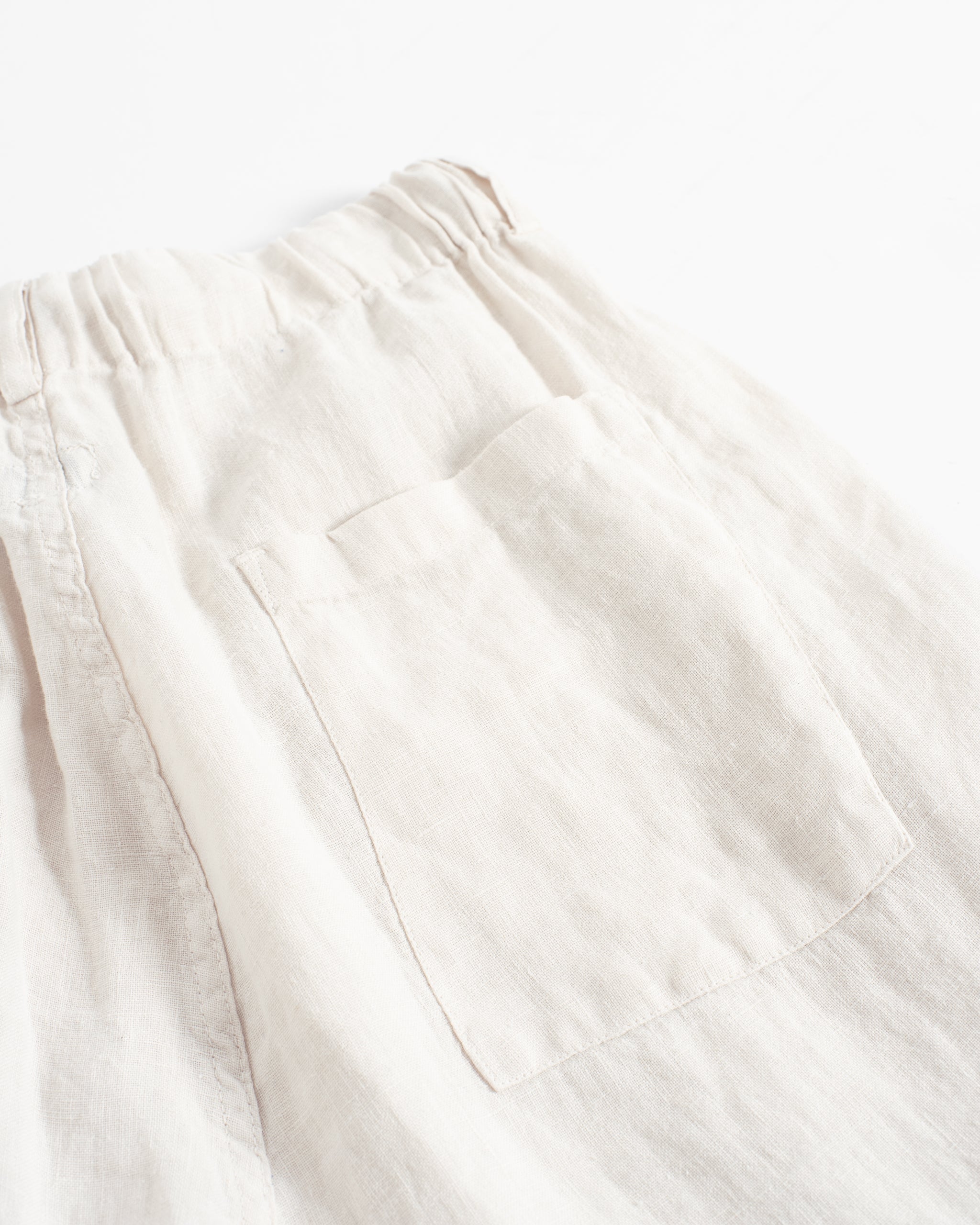 Back pocket detail of Bather men's off-white linen drawstring shorts