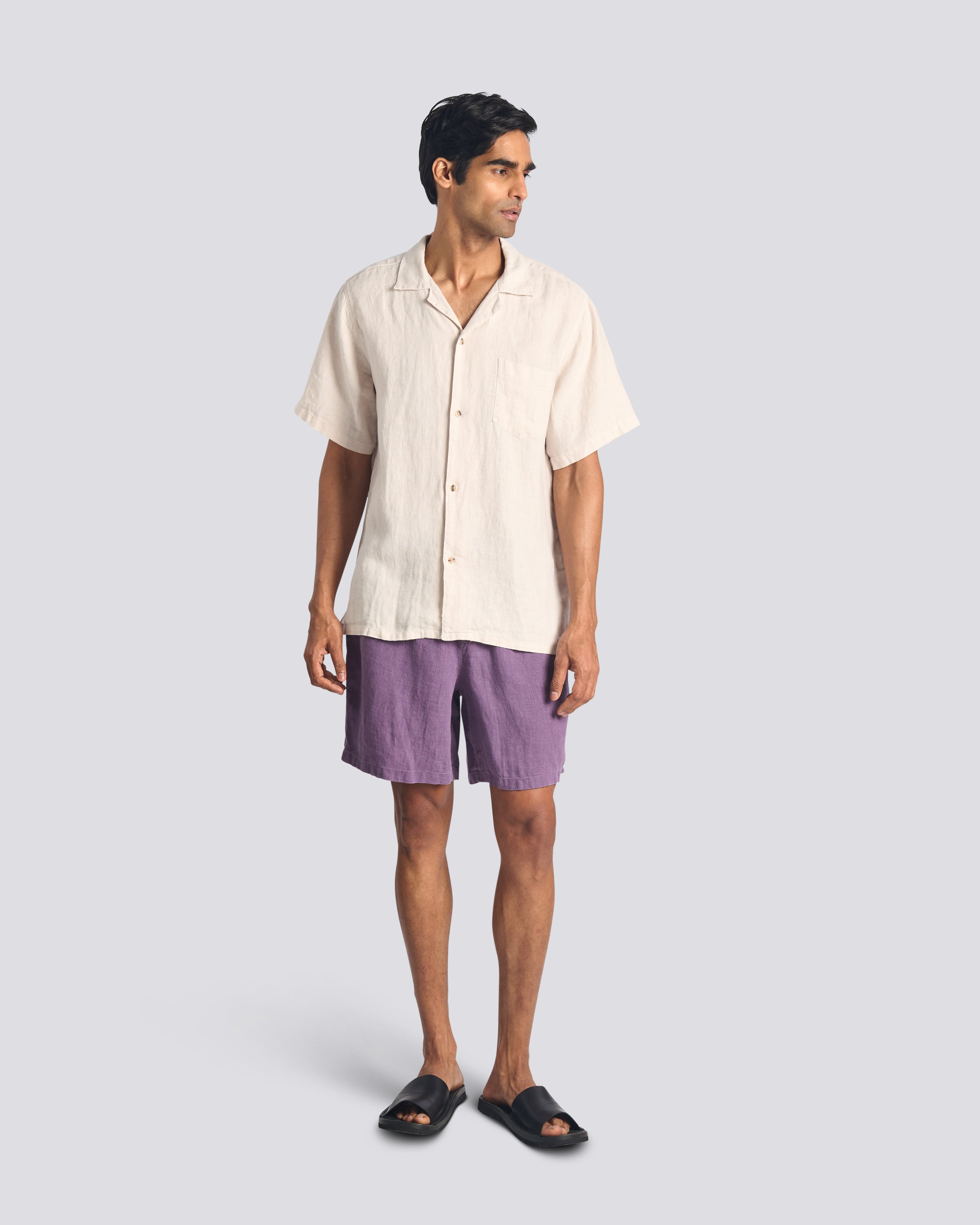 Model wearing Bather men's purple linen drawstring shorts