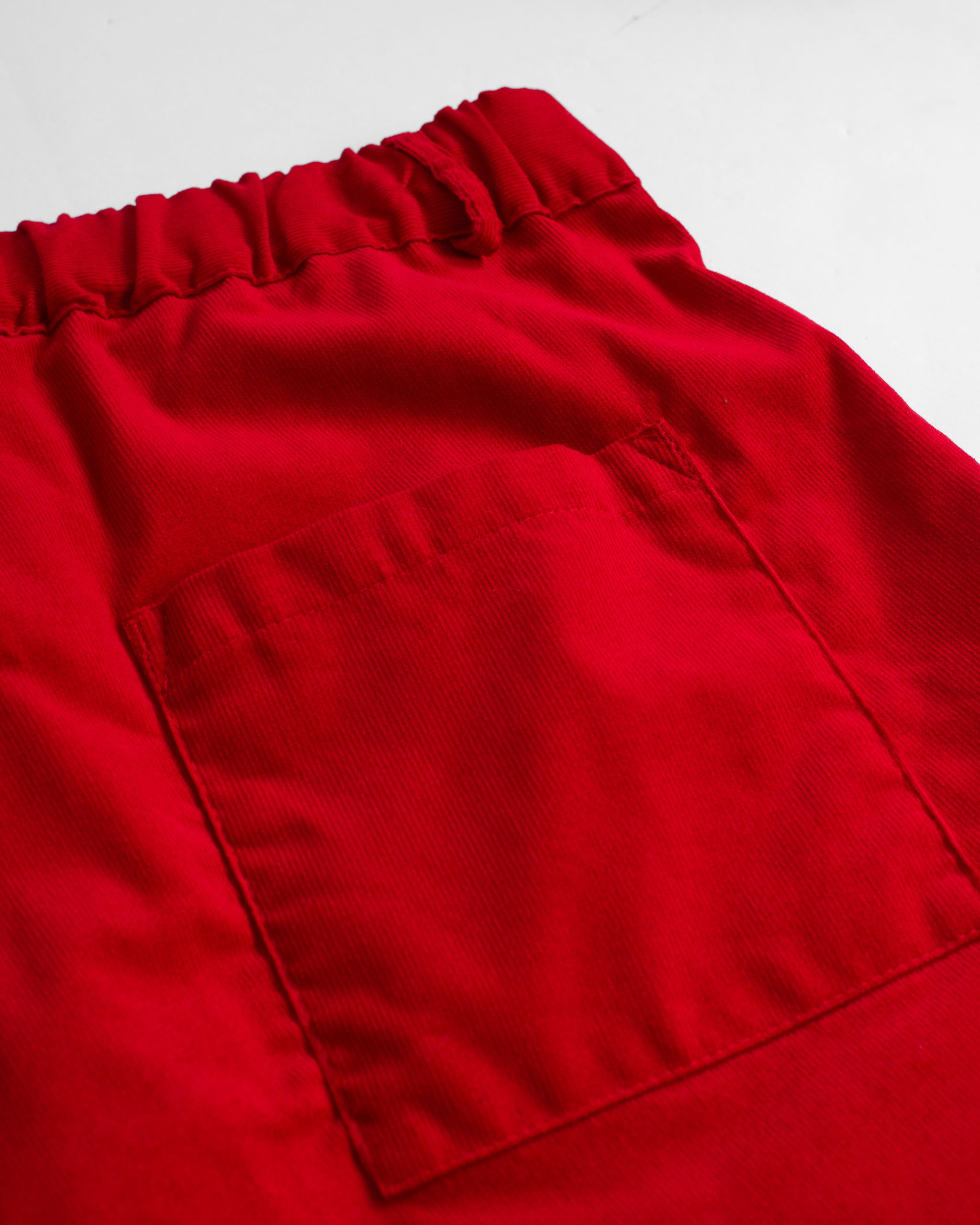 Back pocket detail of Bather men's red corduroy short