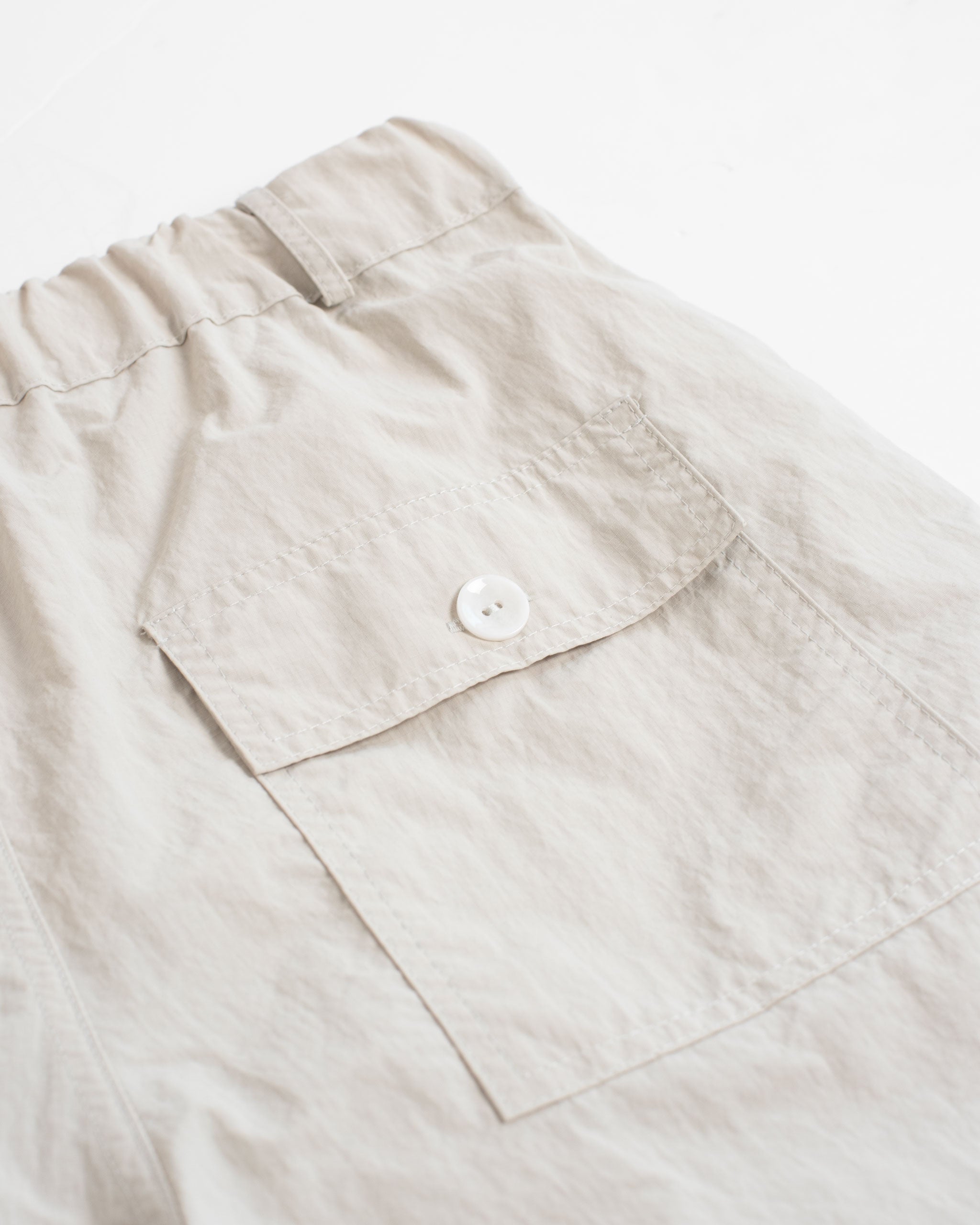 Back pocket shot of Bone coloured utility shorts in 100% Japanese nylon