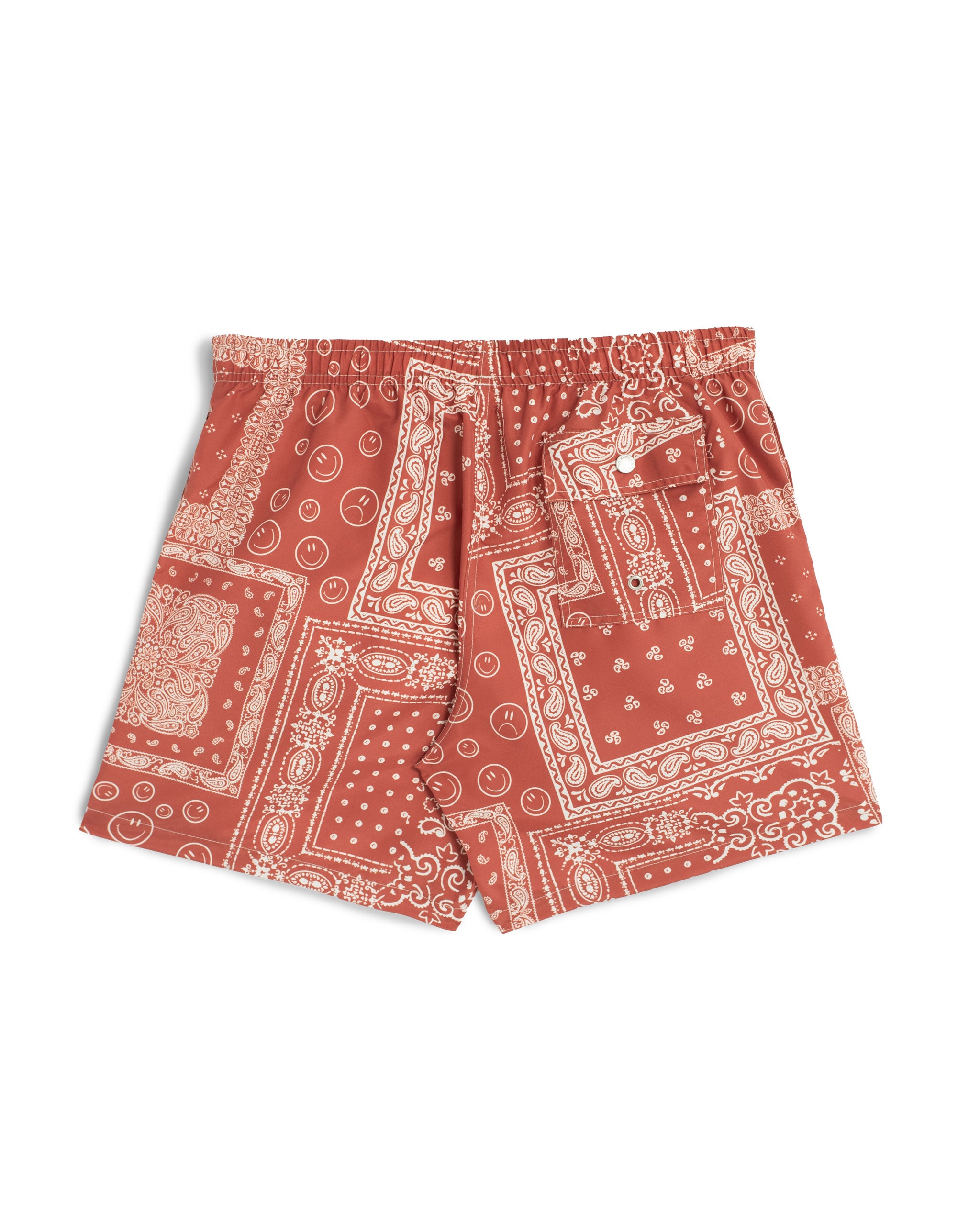 back shot of A terracotta red swim trunk with an all-over bandana print