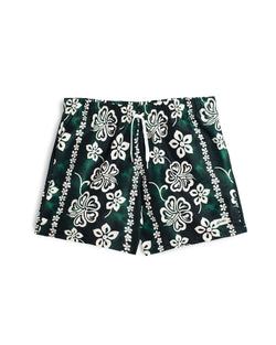 Green Bather swim trunk with a tropical pattern and beige floral motif