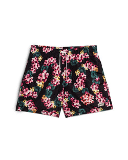 Black bather swim trunk with pink and green floral lei pattern