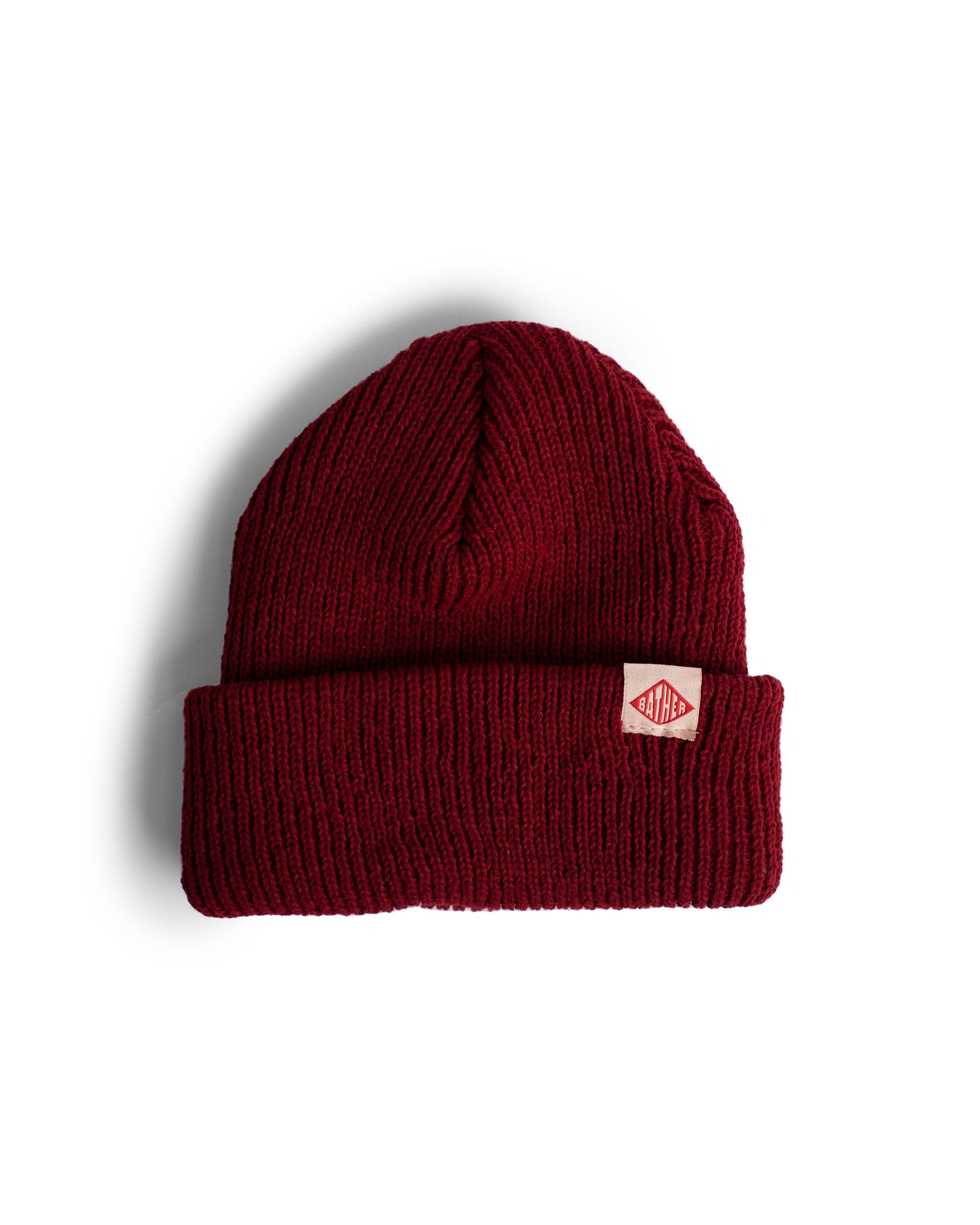 red Bather beanie with exposed brand tag