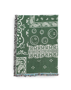 reversible green Bather throw blanket with white bandana pattern