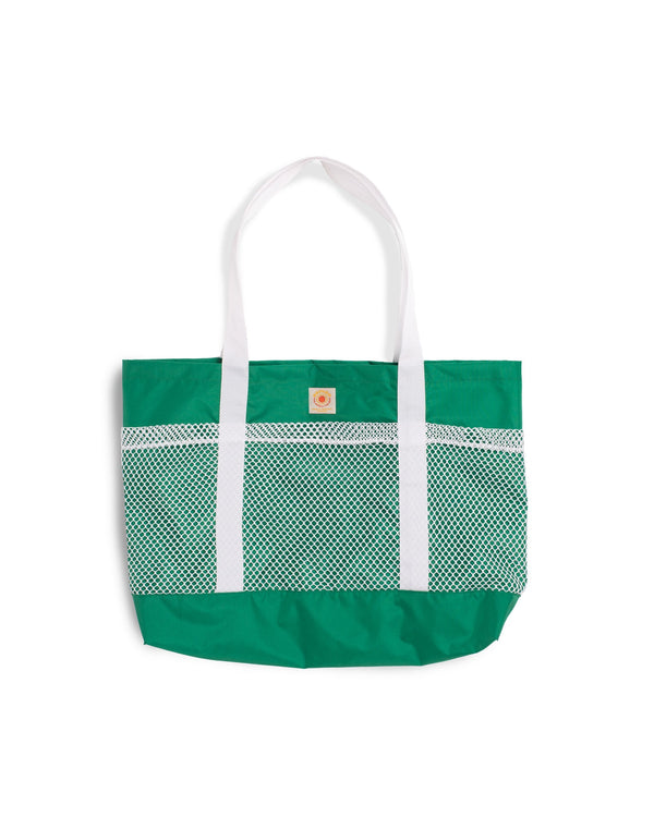 green Bather beach tote bag with white mesh compartments